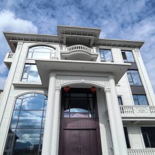 雅安白麻别墅外墙干挂石材效果示例